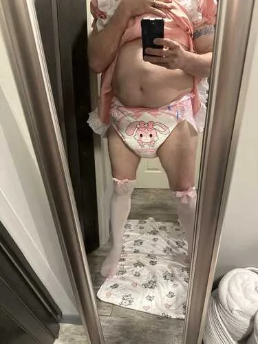 Jessica wearing a delicate outfit in a mirror portrait